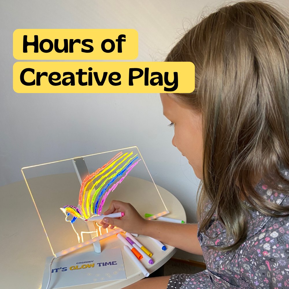 Girl enjoying hours of screen free creative play with the LED drawing board