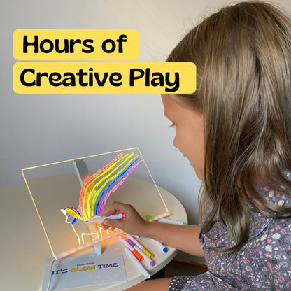 Girl enjoying hours of screen free creative play with the LED drawing board