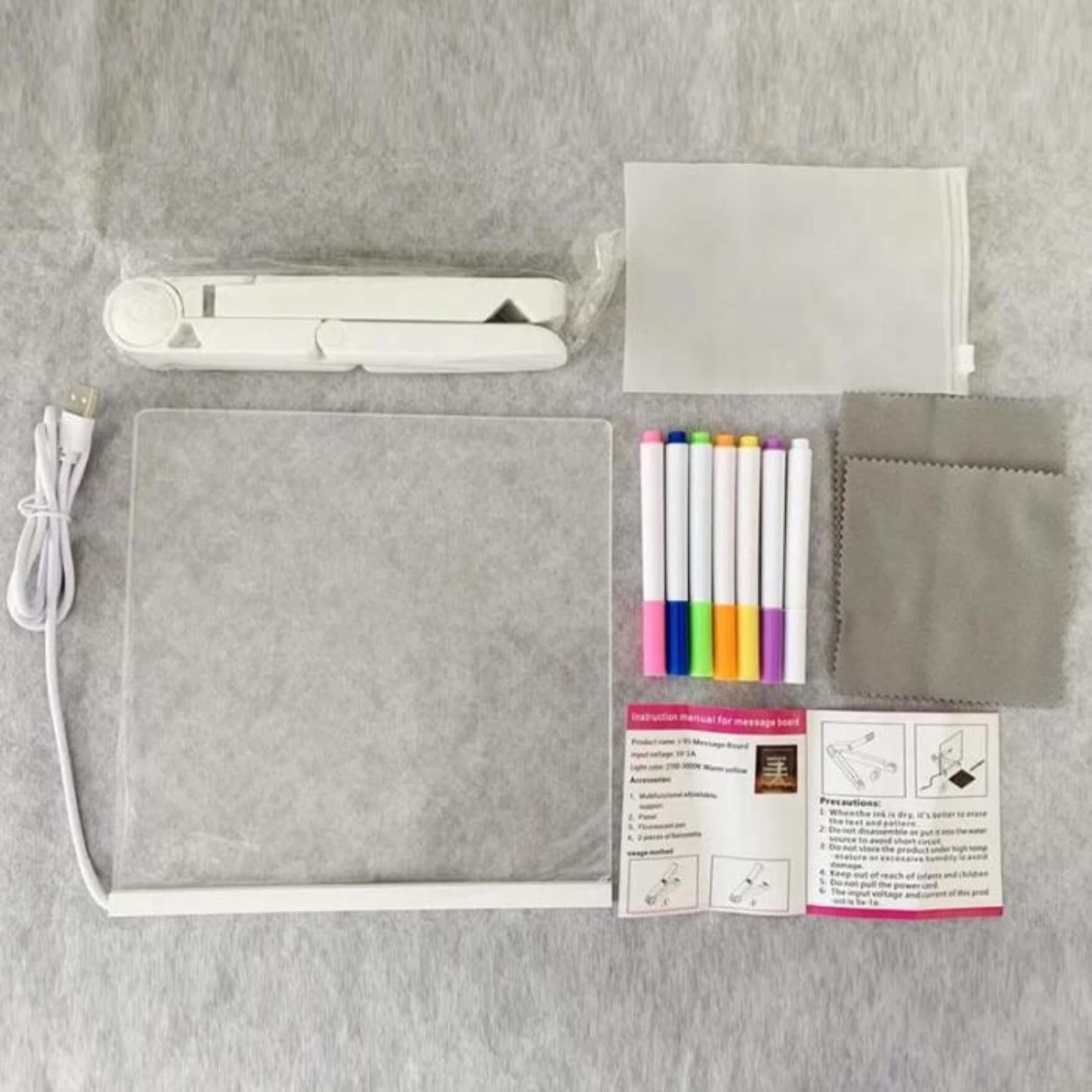 What is in the box: LED drawing board, 7 markers, cable and cloth
