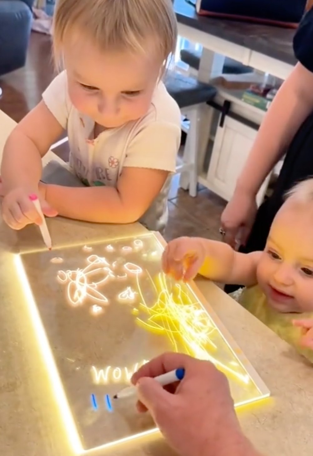 Adult using LumiPens neon markers for creative relaxation