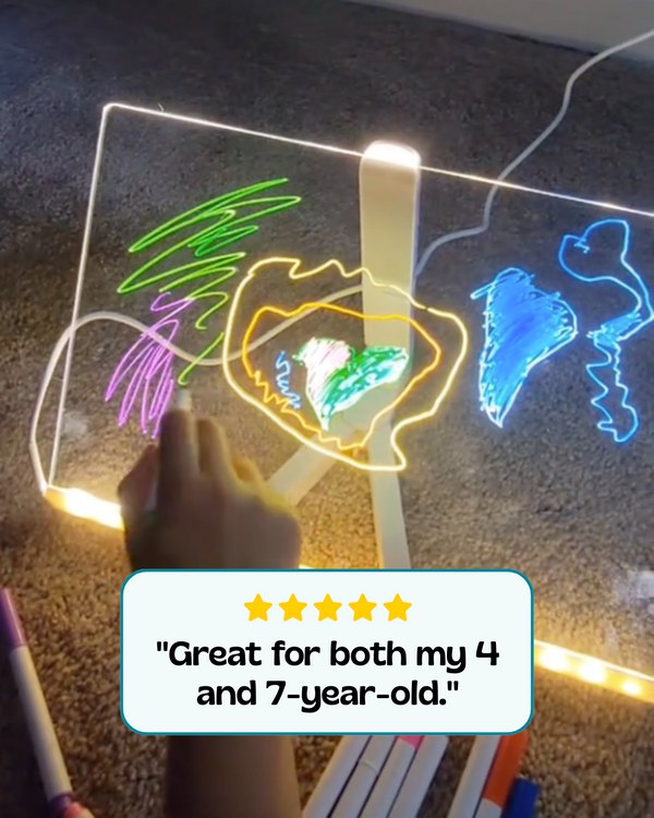 Child drawing on a glowing LED board with a neon marker