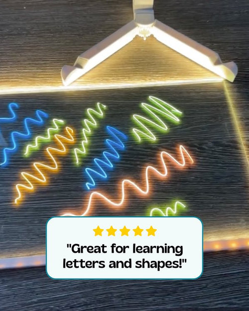 Bright neon strokes drawn with liquid chalk markers on an LED board