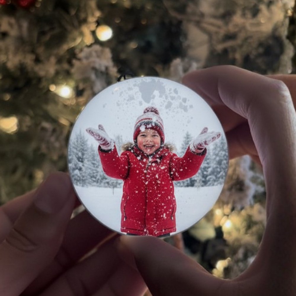 Video globe held up in the snow showing a childhood memory